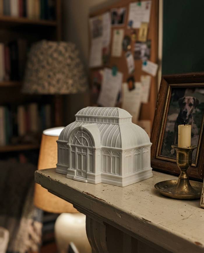A custom venue keepsake in matte engineered ceramic, shown on a shelf